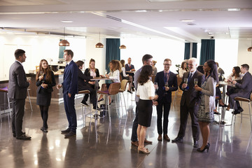 Fototapeta na wymiar Delegates Networking At Conference Drinks Reception