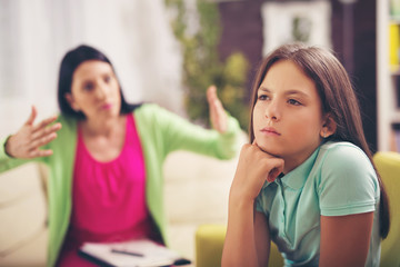 Professional psychologist treating teenage girl of depression