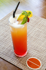 Refreshing cold glass of colorful Sex on the Beach cocktail with