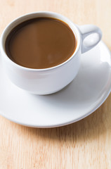 Fototapeta na wymiar Cup of Coffee on Wooden