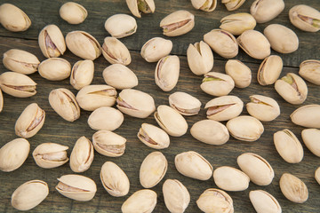 Pistachios on wooden background