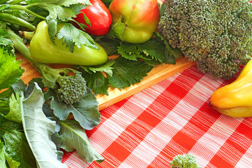Vegetables on a red checkered tablecloth