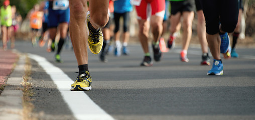 Marathon running race, people feet on city road - obrazy, fototapety, plakaty
