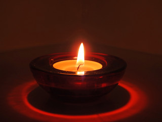 Candles in transparent chandeliers