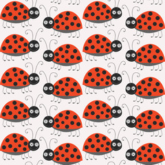 Seamless pattern with cute ladybirds