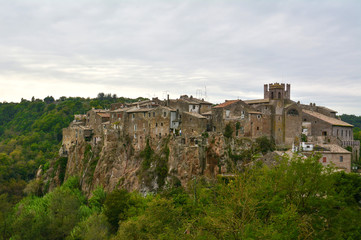 Calcata (Viterbo, Italy) - The old town of Calcata, perched on a mountain of tufa, overlooking the green Treja river valley, in Lazio region.