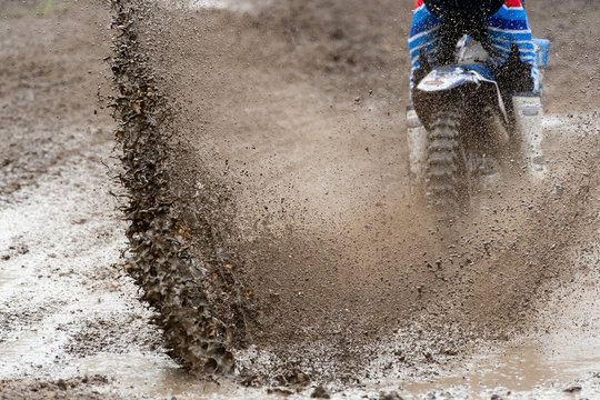 Motocross rider make huge mud splash