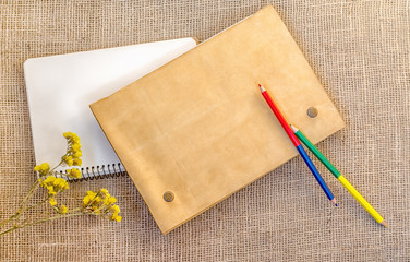 Sampling of stationery - notebook, folder and pencils