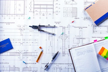 Desktop on which the drawing compasses, pencil and notebook