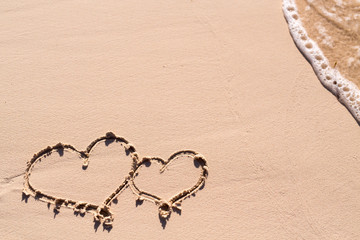 Hearts drawn on beach