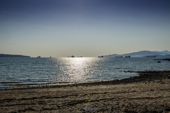 oil tankers moving at twilight, Vancouver, British Columbia