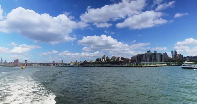 A daytime view of the Brooklyn skyline as seen from the East River Ferry on the way to Governors Island.	 	
