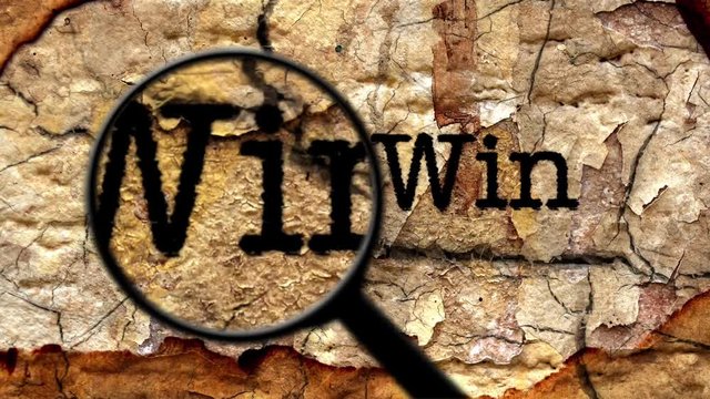 Magnifying glass on win text