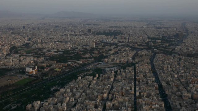 Extreme long shot aerial drone view of a metropolis day time evening