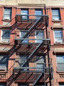 Fire escape on exterior of walk up apartment building in New York City