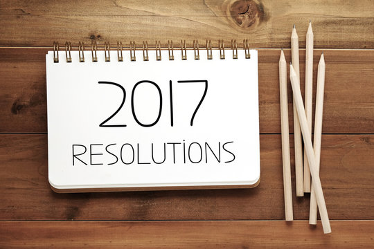 2017 resolutions on blank paper note book background