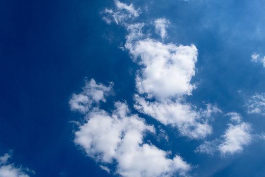 Deep Blue Sky With Clouds