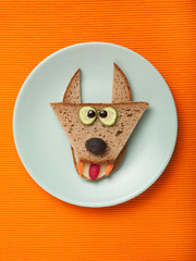 Wolf made of bread on plate and fabric