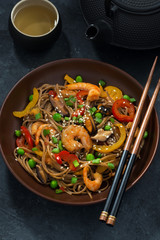 Asian lunch. Buckwheat noodles with seafood and vegetables