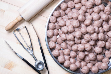 Sweet Taro Balls, Thai dessert, with Baking Tools on wood background