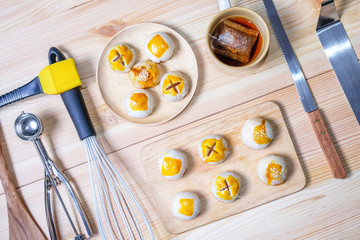 Chinese pastry moon cake with a cup of tea and baking tools