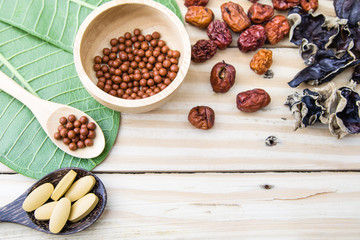 Herbal medicine,  herbs, herbal pills, tablets on wood backgroun