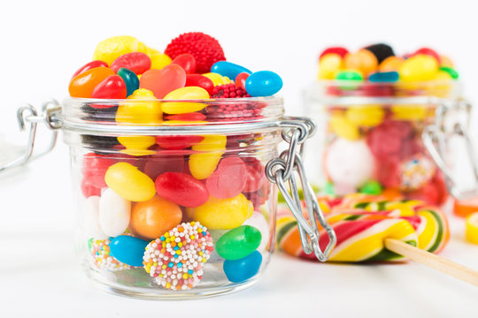 Full jar of colorful candy closeup