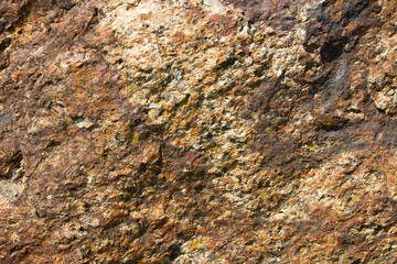 Bright brown granite texture with natural pattern. Background of natural stone.