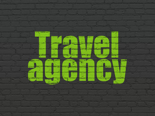 Fototapeta premium Vacation concept: Travel Agency on wall background