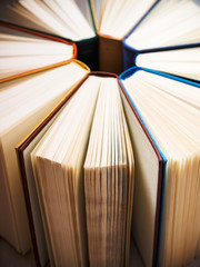 Pile of old antique books on the table. Shallow focus