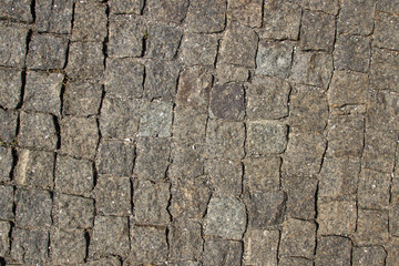 Dark brown granite texture with natural pattern. Background of the plurality of pieces natural stones.