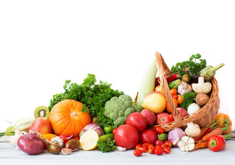 Plakat Composition with vegetables and fruits in wicker basket.