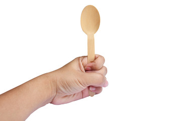 Wooden spoon in hand isolated on a white background
