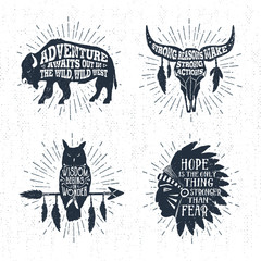 Obraz premium Hand drawn tribal labels set with buffalo, skull, owl, and headdress vector illustrations and inspirational lettering.