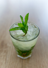 Mojito cocktail on wooden table