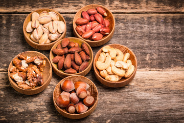 Mix nuts on wooden table,healthy vegan food.