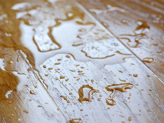Parquet. Water drops on wooden surface.
