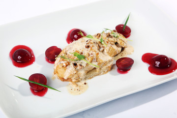 chicken breast with sauce and cherry