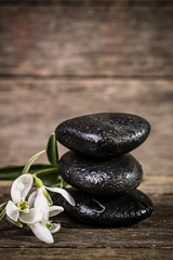 spa concept with stone and candles  on wooden table ,