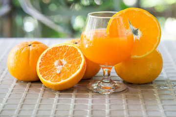 Fresh orange and orange juice in glass