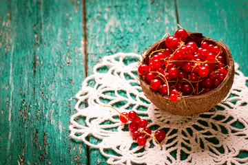 Redcurrant berries on wooden table,healthy food.