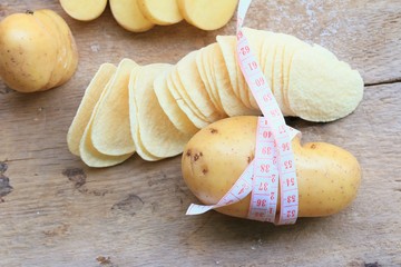 Fresh potatoes with potatoes chips