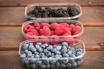 Fresh summer berries , wooden background, healthy food.