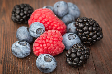 Fresh summer berries , wooden background, healthy food.