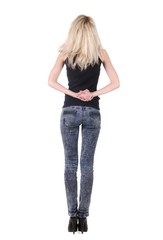 Obraz premium Beautiful young woman looking at wall. Rear view.