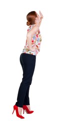 back view of woman screams with his hand to his mouth. girl  watching. Rear view people collection.  backside view of person.  Isolated over white background.  Girl in office attire stands back