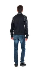 Back view of handsome man in winter jacket  looking up.   Standing young guy in parka. Rear view people collection.  backside view of person.  Isolated over white background. A guy in a black jacket