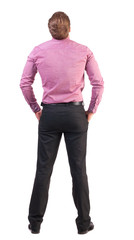 back view of Business man  looks ahead. Young guy in pink shirt watching.  Rear view people collection.  backside view of person.  Isolated over white background. broad-office worker with his hands in