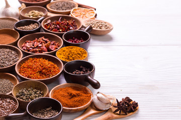 spices and herbs on wooden table.