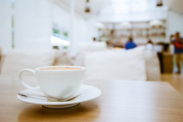cup of coffee on table in coffee shop cafe